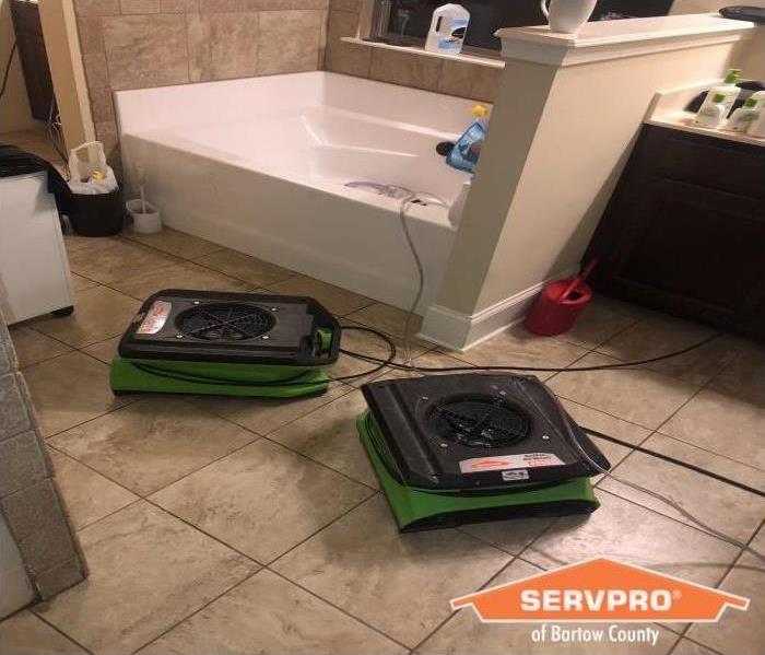 Equipment placed in Water damaged tile bathroom due to toilet supply line leack